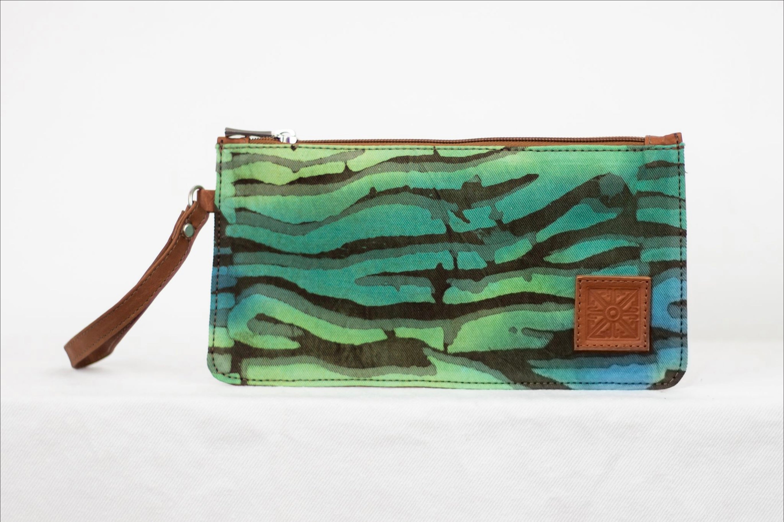 * Hand painted, leather trimmed clutch purse with the greens, blues, and neutral “Boo Verdi Blue” pattern. #1