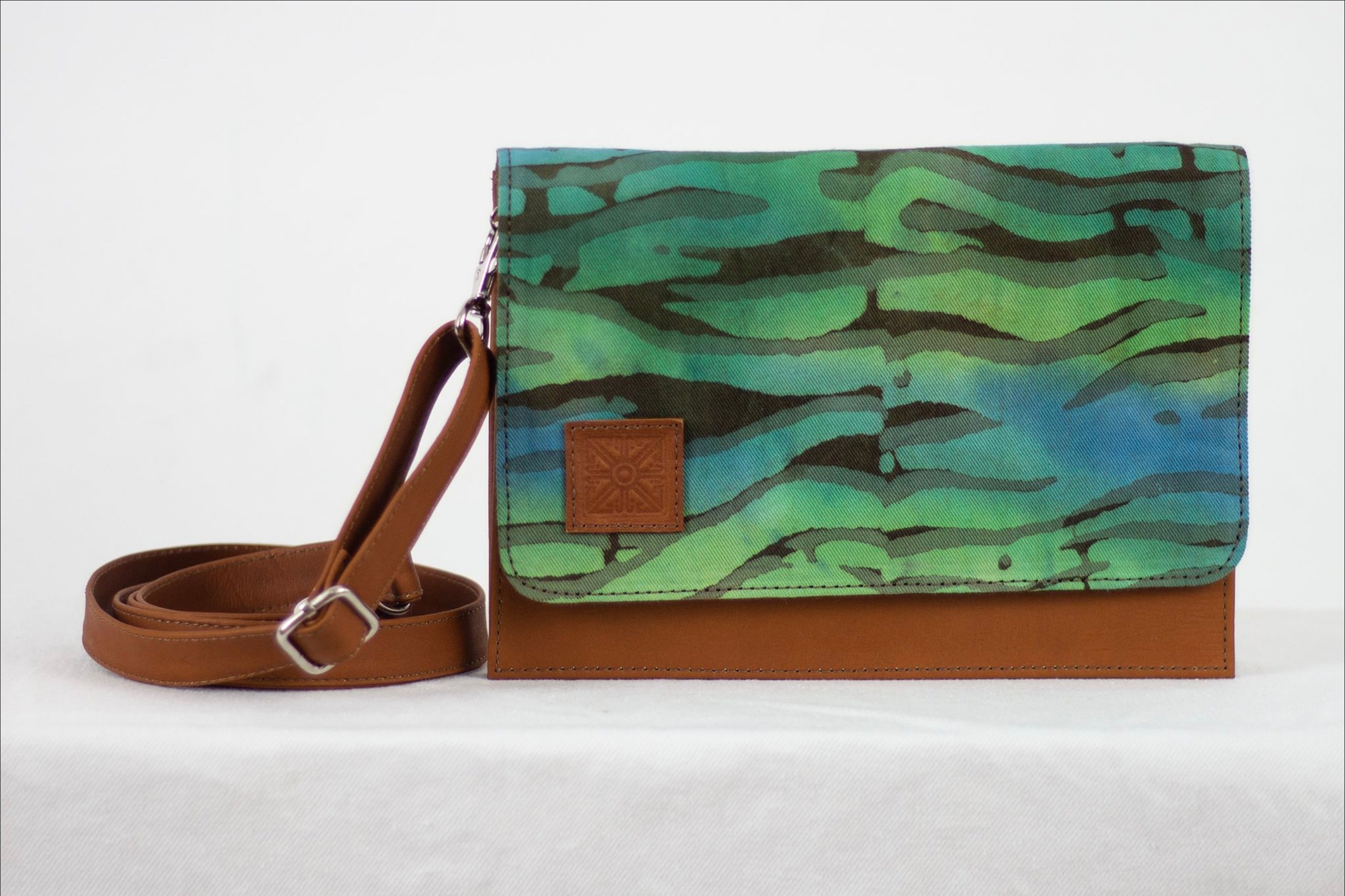 Hand painted, leather trimmed cross body tote with the green and blue “Boo Verdi Blue” pattern #1
