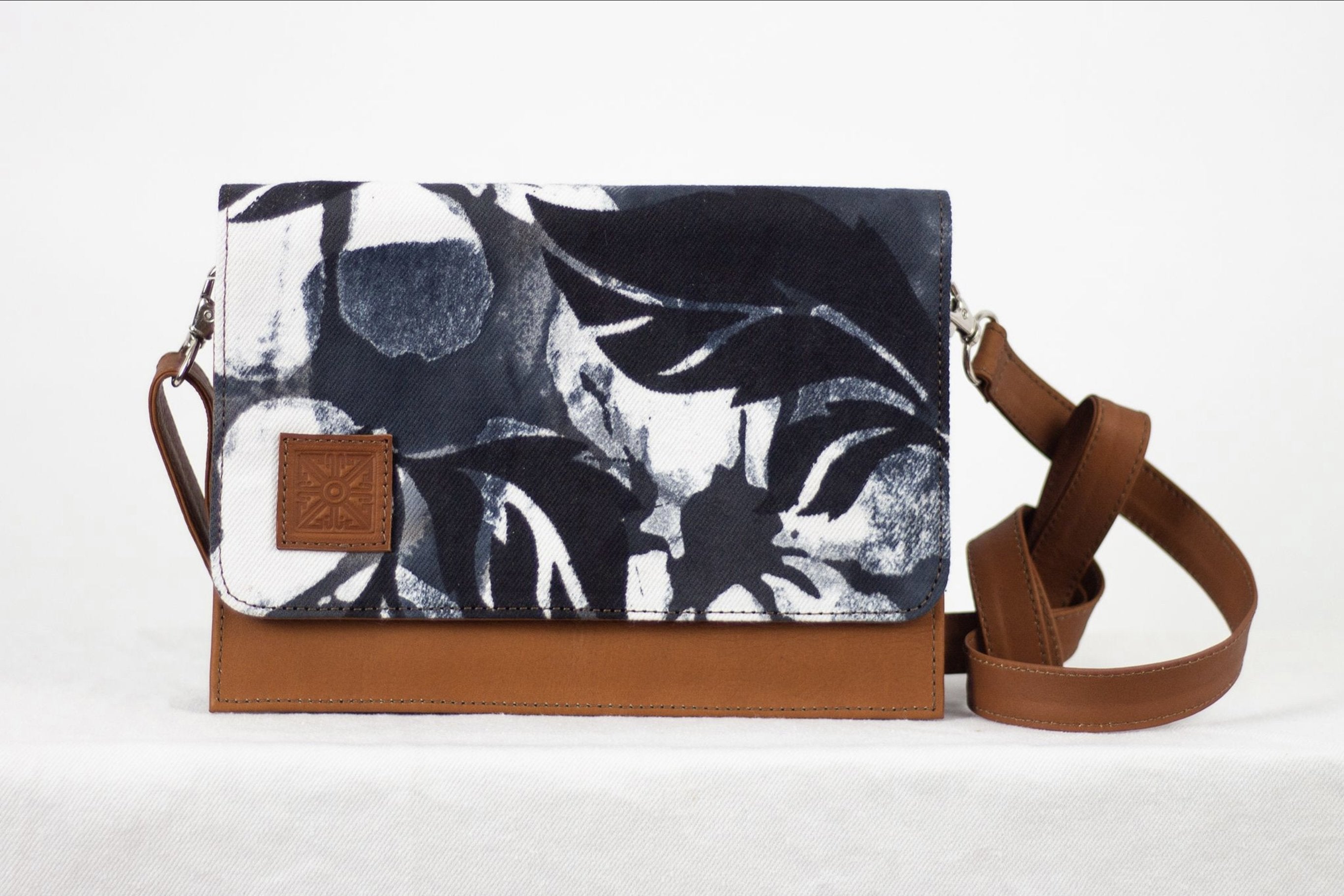 * Hand painted, leather trimmed cross body tote with the black and white “hula nights” pattern. #2