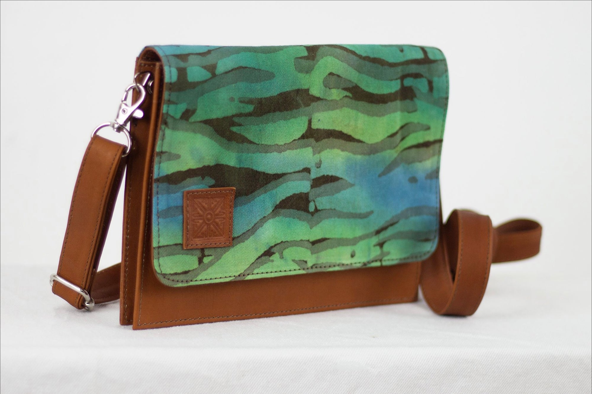 Hand painted, leather trimmed cross body tote with the green and blue “Boo Verdi Blue” pattern #1